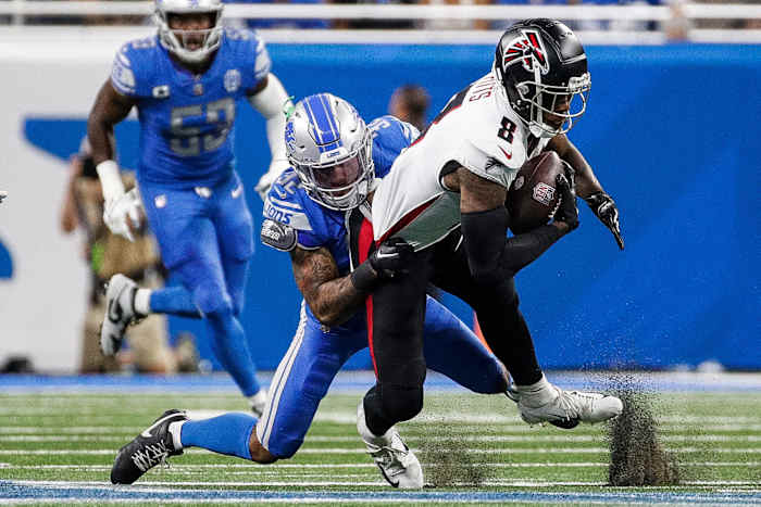 Detroit Lions safety Brian Branch (32) tackles Atlanta Falcons tight end Kyle Pitts (8) during the first half at Ford Field in Detroit on Sunday, Sept. 24, 2023.